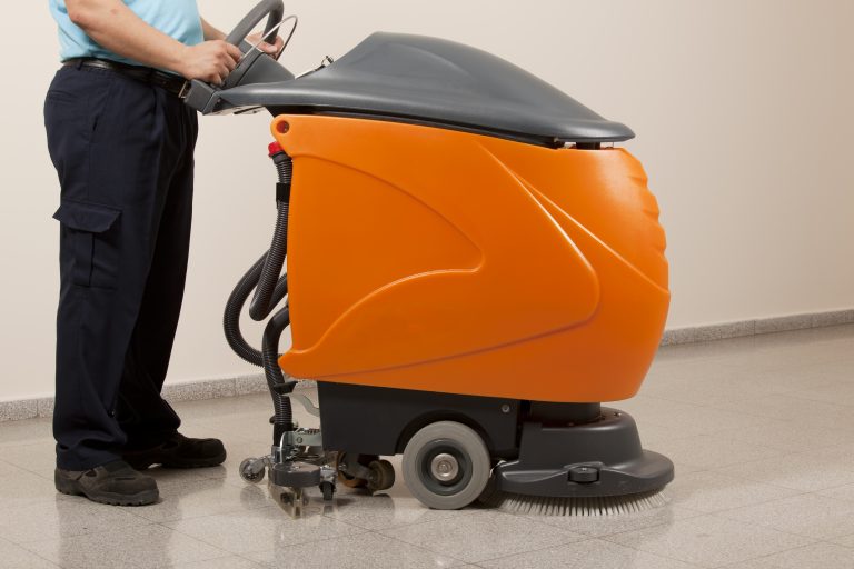 worker-cleaning-the- floor-with-scrubber -machine